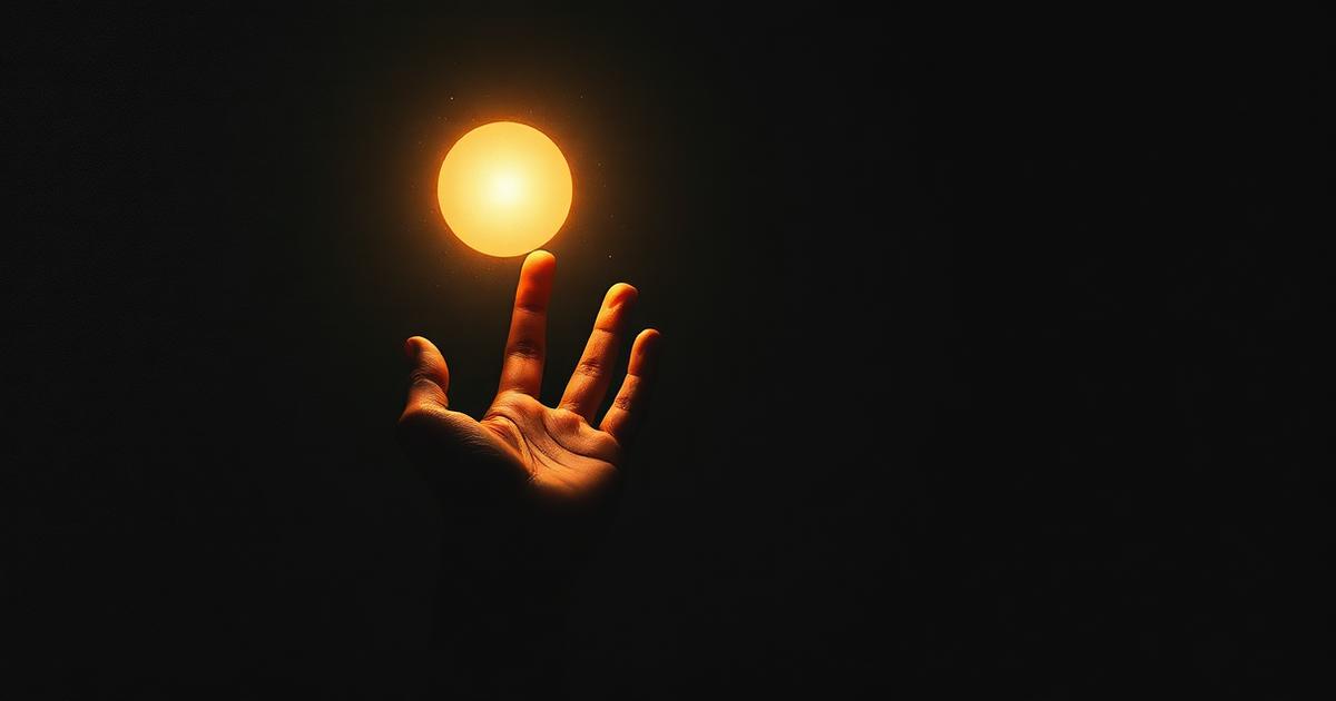 A hand holding a sphere of light, evoking questions, prayer and illumination